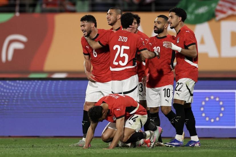 Egypt's defender #6 Yasser Ibrahim (L) celebrates scoring his team's second goal during the Africa Cup of Nations (CAN) round of 16 football match between Egypt and Benin at the Grand Stadium in Agadir on January 5, 2026.   FRANCK FIFE / AFP