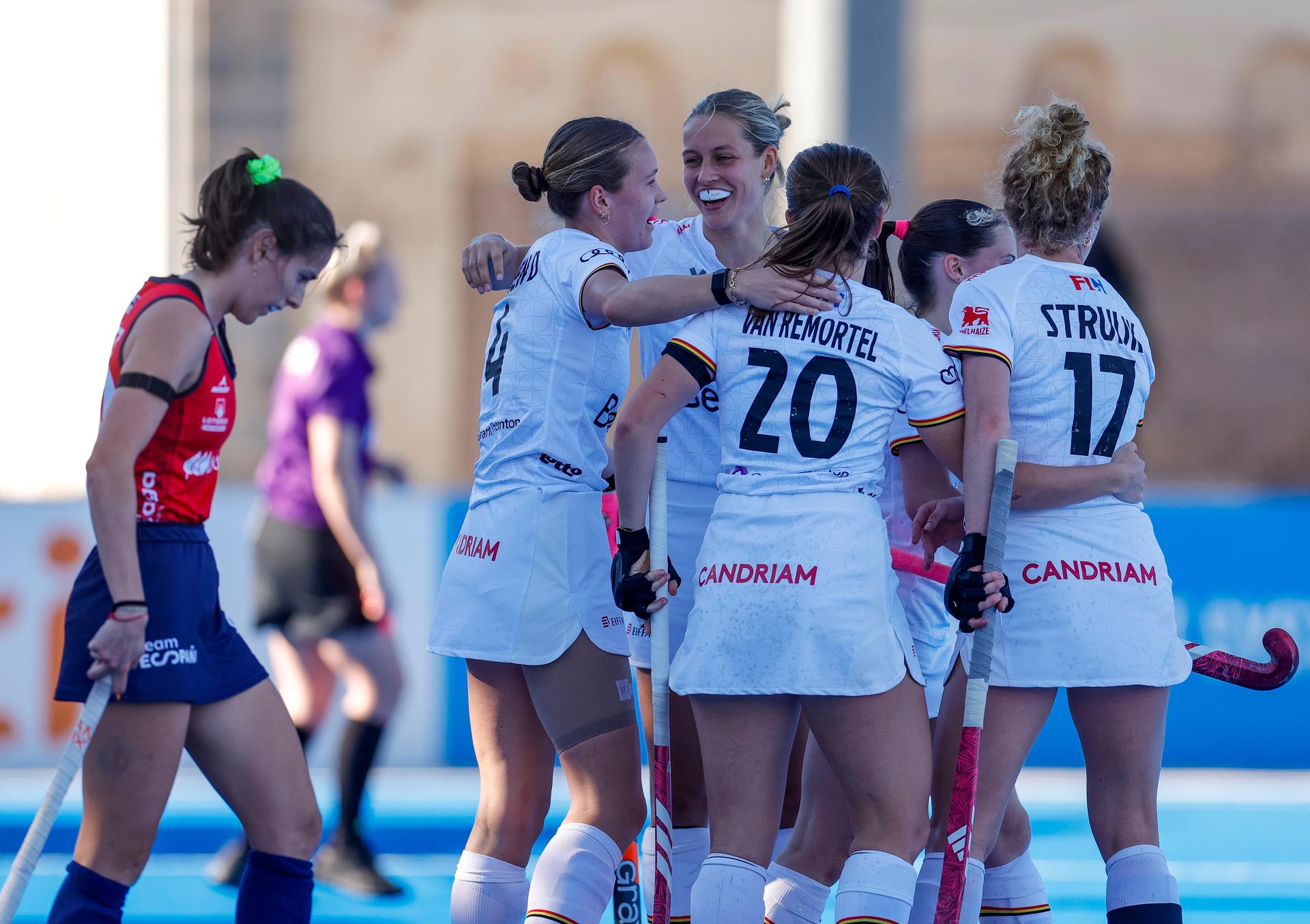 Belgium's Delphine Marien (R), Belgium's Alexi Van Remortel (C) and Belgium's Michelle Struijk (R) celebrate after scoring a goal at a hockey game between Belgian national team Red Panthers and Spain, The fifth game (out of 16) in the group stage of the 2025-2026 women's FIH Pro League, Thursday 05 February 2026 in Valencia, Spain.  BELGA PHOTO DAVID GONZALEZ