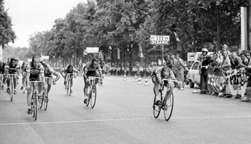 Belgian sprinter Walter Godefroot (R) wins the 22nd and last stage of the Tour de France beating to the finish line Frenchman Robert Mintkiewicz (L), Dutch Gerben Karstens (3rd L, partially hidden) and Frenchman Regis Delepine (C) on July 20, 1975 on the Champs-Elysees in Paris. For the first time ever, Tour de France organizers decided to have riders finish on the most famous avenue in Paris after a 27-lap circuit around the Champs-Elysees and the Tuileries gardens. AFP PHOTO