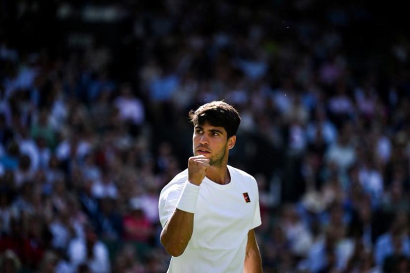 Spain's Carlos Alcaraz celebrates after winning a point against Britain's Oliver Tarvet during their men's singles second round tennis match on the third day of the 2025 Wimbledon Championships at The All England Lawn Tennis and Croquet Club in Wimbledon, southwest London, on July 2, 2025.  Kirill KUDRYAVTSEV / AFP
