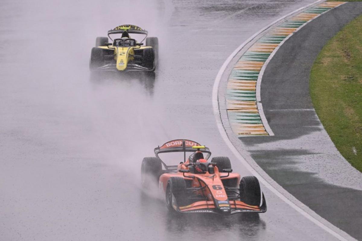 Formula 2 MP Motorsport's Dutch driver Richard Verschoor (R) and other drivers take part in a parade before the Australian Formula One Grand Prix at Albert Park Circuit in Melbourne on March 16, 2025.  WILLIAM WEST / AFP