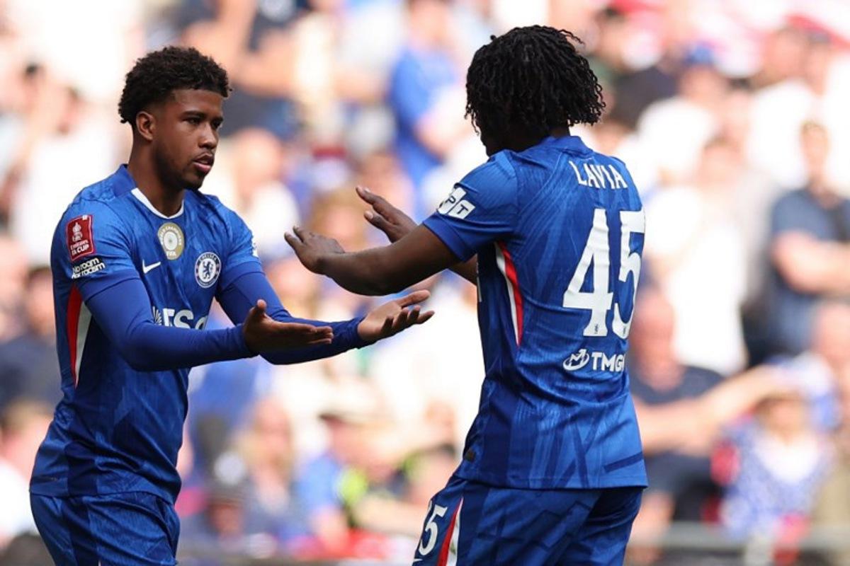 Chelsea's Brazilian midfielder #17 Andrey Santos (L) comes on for Chelsea's Belgian midfielder #45 Romeo Lavia (R) during the English FA Cup semi final football match between Chelsea and Leeds United at Wembley stadium in London, on April 26, 2026.  Adrian Dennis / AFP
