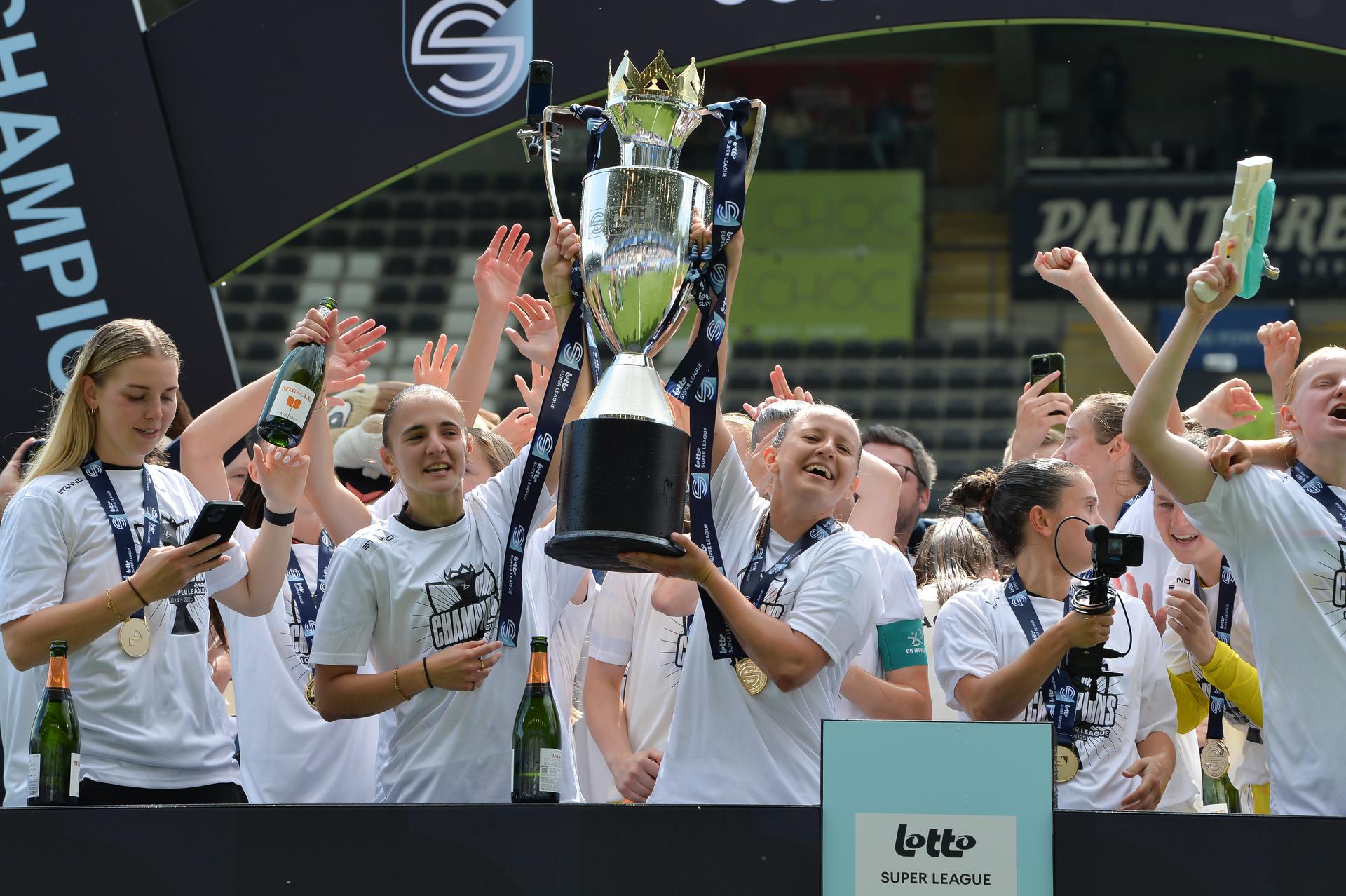OHL's players celebrate the championship, after winning a soccer match between Oud-Heverlee Leuven and RSCA Women, Saturday 17 May 2025 in Heverlee, on day 6 (out of 6) of the Play-offs of the 2024-2025 'Super League Women' first division of the Belgian championship. BELGA PHOTO JILL DELSAUX
