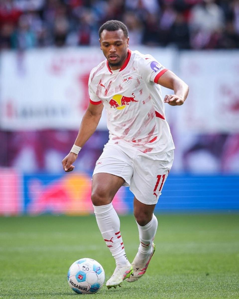 Leipzig's Belgian forward #11 Lois Openda plays the ball during the German first division Bundesliga football match between RB Leipzig and TSG 1899 Hoffenheim in Leipzig, eastern Germany on April 5, 2025.  Ronny Hartmann / AFP
