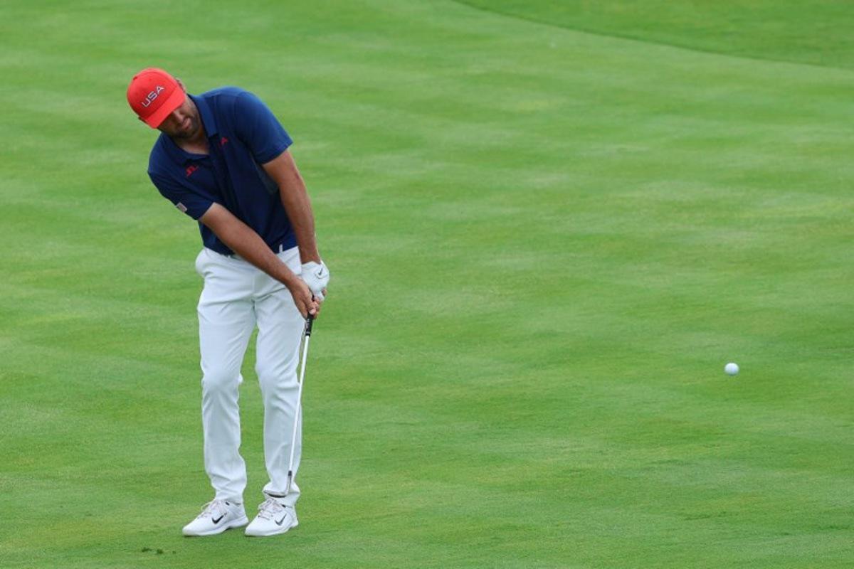 US' Scottie Scheffler competes in round 3 of the men's golf individual stroke play of the Paris 2024 Olympic Games at Le Golf National in Guyancourt, south-west of Paris on August 3, 2024.   Emmanuel DUNAND / AFP