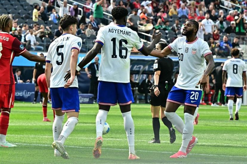 USA's forward #16 Patrick Agyemang celebrates with teammates after scoring his team's first goal during the CONCACAF Nations League third place final football match between USA and Canada at SoFi Stadium in Inglewood, California, on March 23, 2025.  Frederic J. Brown / AFP