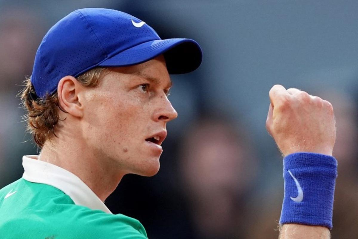Italy's Jannik Sinner reacts after a point during his men's singles semi-final match against Serbia's Novak Djokovic on day 13 of the French Open tennis tournament on Court Philippe-Chatrier at the Roland-Garros Complex in Paris on June 6, 2025.  Dimitar DILKOFF / AFP