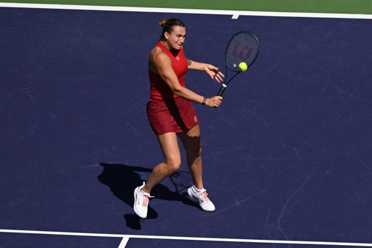 Belarus' Aryna Sabalenka returns the ball to Russia's Mirra Andreeva during the women's singles final tennis match at the BNP Paribas Open at the Indian Wells Tennis Garden in Indian Wells, California, on March 16, 2025.  Patrick T. Fallon / AFP