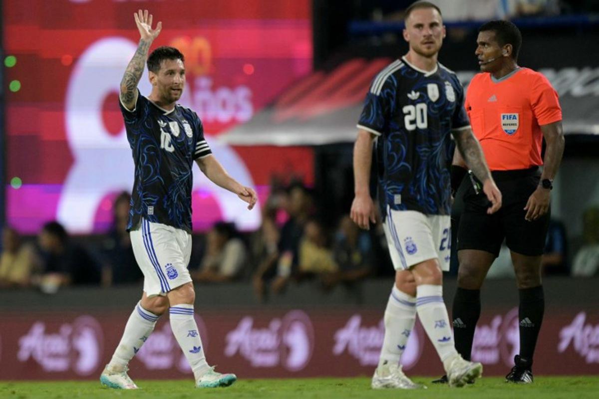 Argentina's forward #10 Lionel Messi gestures next to teammate midfielder #20 Alexis Mac Allister during a friendly football match between Argentina and Zambia at La Bombonera stadium in Buenos Aires on March 31, 2026.  JUAN MABROMATA / AFP