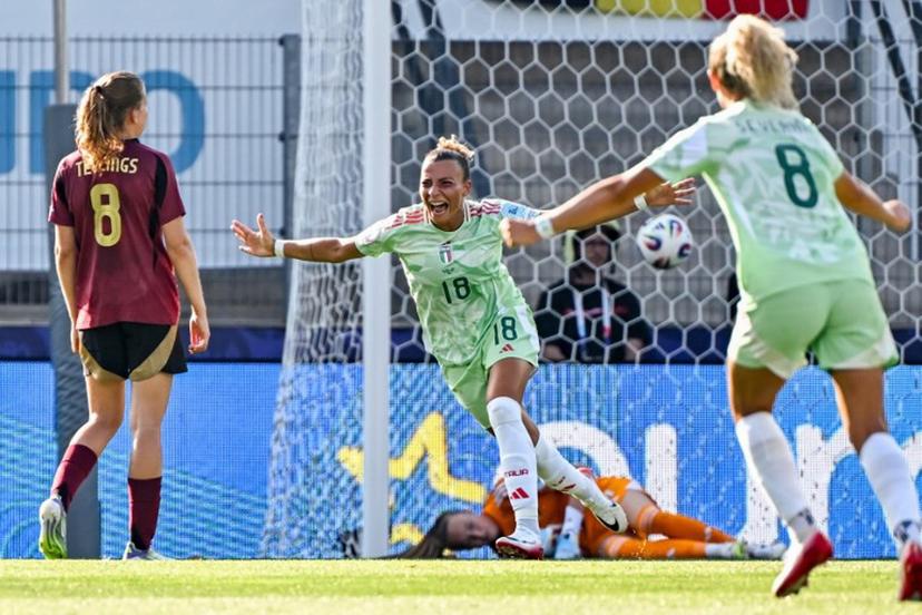 Italy's midfielder #18 Arianna Caruso reacts after scoring the first goal of the match during the UEFA Women's Euro 2025 Group B football match between Belgium and Italy at the Stade de Tourbillon in Sion, on July 3, 2025.  Fabrice COFFRINI / AFP
