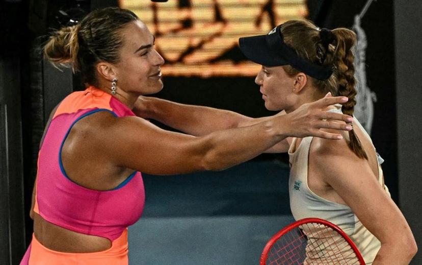 Kazakhstan's Elena Rybakina (R) greets Belarus' Aryna Sabalenka after her victory in their women's singles final match on day fourteen of the Australian Open tennis tournament in Melbourne on January 31, 2026.  WILLIAM WEST / AFP