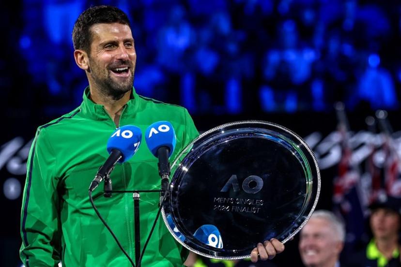 Serbia's Novak Djokovic speaks after receiving the runner-up shield following his defeat to Spain's Carlos Alcaraz in the men's singles final on Day 15 of the Australian Open. tennis tournament in Melbourne on February 1, 2026.  IZHAR KHAN / AFP
