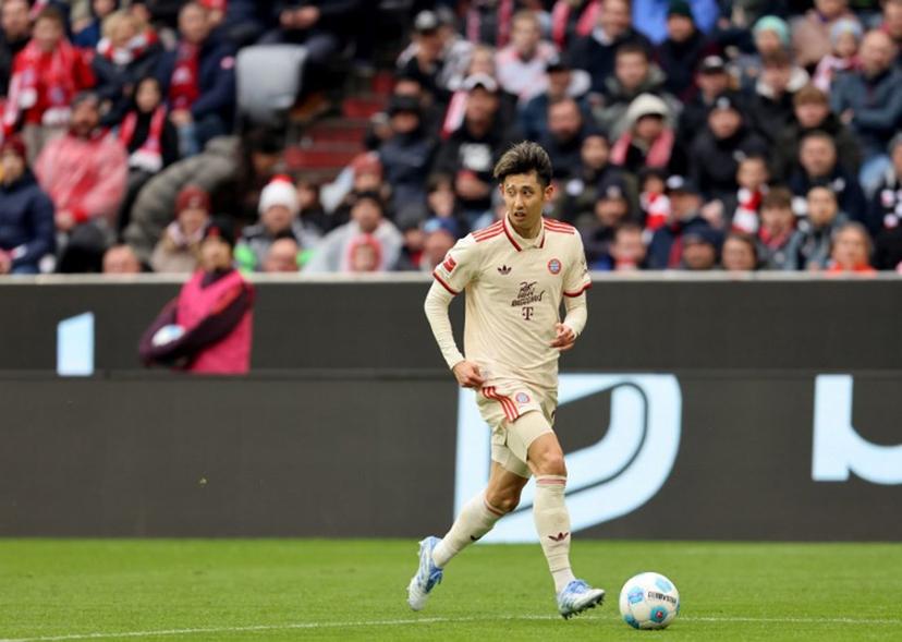 Bayern Munich's Japanese defender #21 Hiroki Ito plays the ball during the German first division Bundesliga football match between FC Bayern Munich and St Pauli in Munich, southern Germany on March 29, 2025.  Alexandra BEIER / AFP