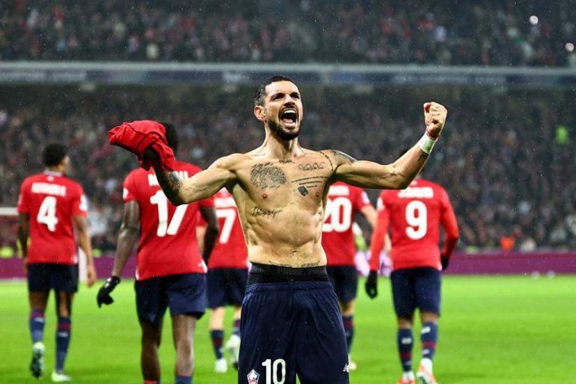 Lille's French midfielder #10 Remy Cabella celebrates scoring his team's sixth goal during the UEFA Champions League, league phase - matchday 8 football match between Lille OSC (LOSC) and Feyenoord Rotterdam at the Stade Pierre-Mauroy in Villeneuve-d'Ascq in Northern France, on January 29, 2025.  Sameer Al-Doumy / AFP