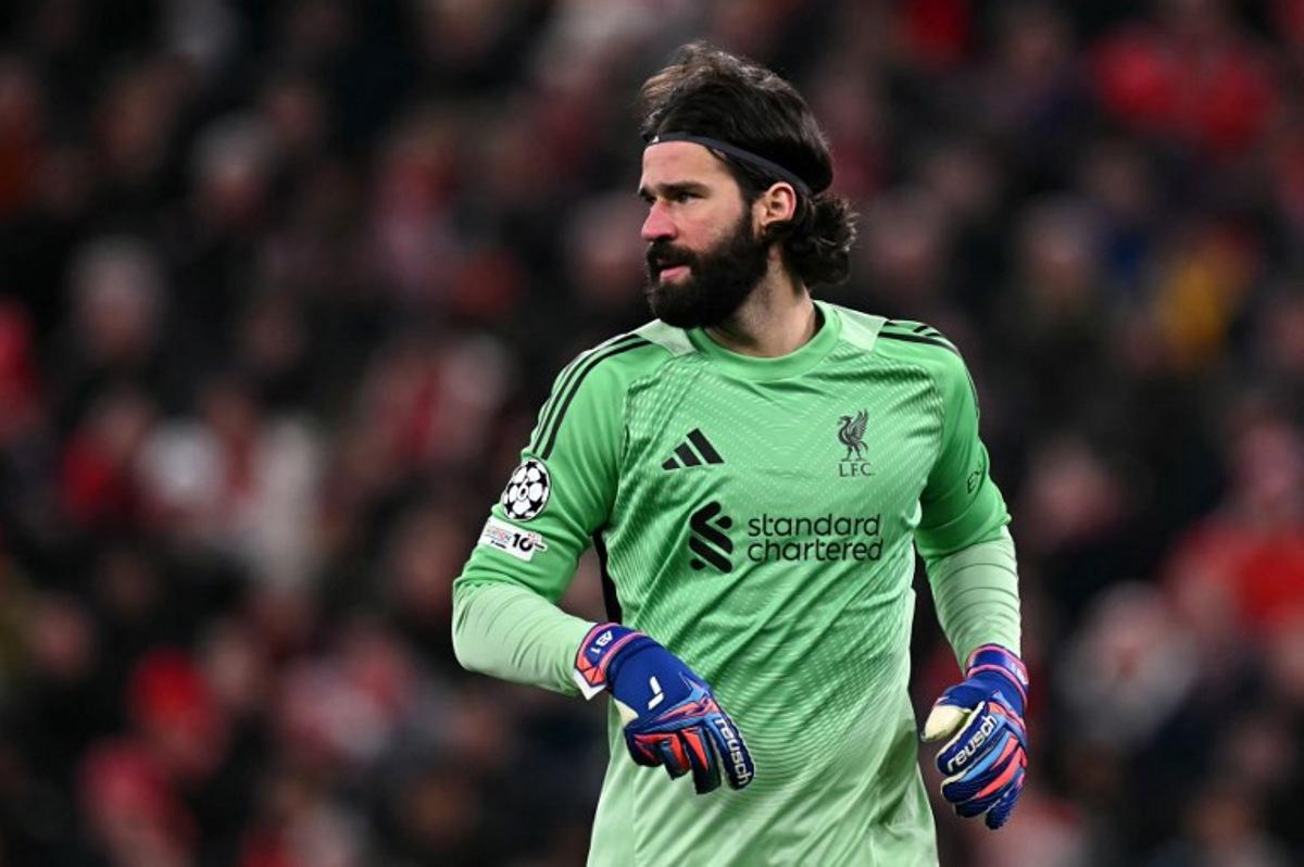 Liverpool's Brazilian goalkeeper #01 Alisson Becker looks on during the UEFA Champions League football match between Liverpool and Qarabag at Anfield in Liverpool, north west England on January 28, 2026.  Paul ELLIS / AFP