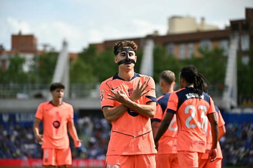Barcelona's Spanish midfielder #16 Fermin Lopez celebrates scoring his team's first goal during the Spanish league football match between Getafe CF and FC Barcelona at the Coliseum stadium in Getafe on April 25 , 2026.  Javier SORIANO / AFP