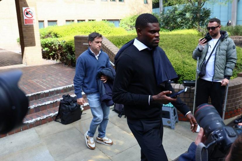 Former Arsenal midfielder Thomas Partey departs following his hearing at the Southwark Crown Court in London on April 13, 2026. Partey, who now plays for Spanish club Villarreal, was charged in February with two further counts of rape. Toby Shepheard / AFP