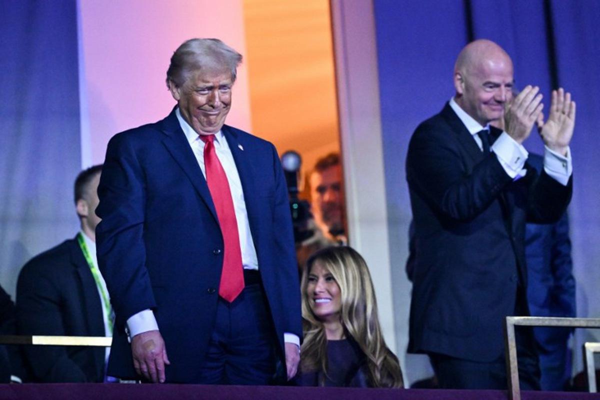 (L/R) US President Donald Trump, US First Lady Melania Trump, and FIFA President Gianni Infantino attend the draw for the 2026 FIFA Football World Cup taking place in the US, Canada and Mexico, at the Kennedy Center, in Washington, DC, on December 5, 2025.  Mandel NGAN / POOL / AFP