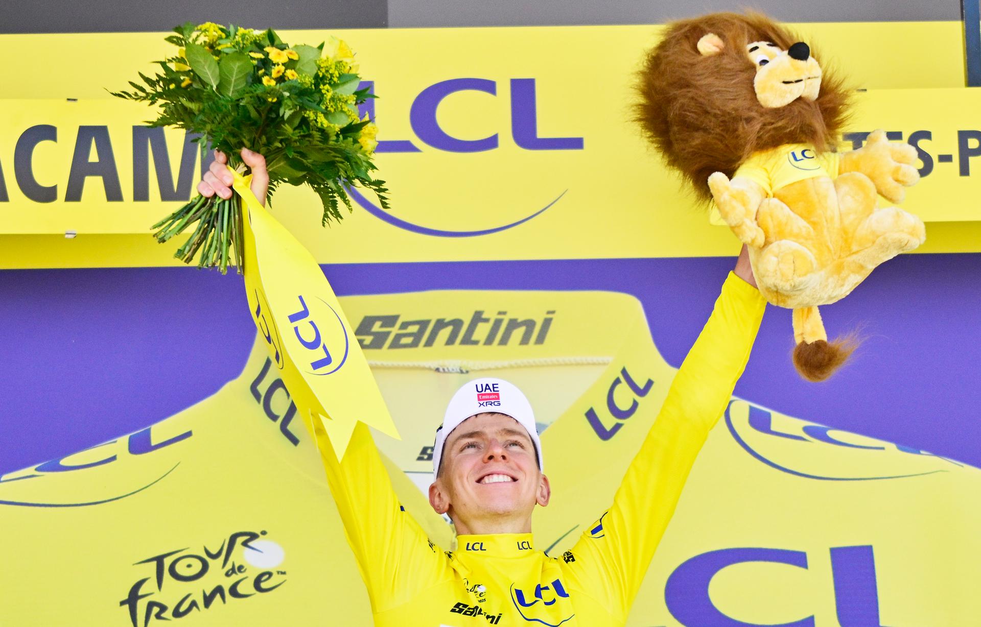Slovenian Tadej Pogacar of UAE Team Emirates celebrates on the podium in the yellow jersey of leader in the overall ranking after stage 12 of the 2025 Tour de France cycling, from Auch to Hautacam (181 km), on Thursday 17 July 2025 in France. The 112th edition of the Tour de France starts on Saturday 5 July in Lille, France, and will finish in Paris, France on the 27th of July.   BELGA PHOTO DIRK WAEM