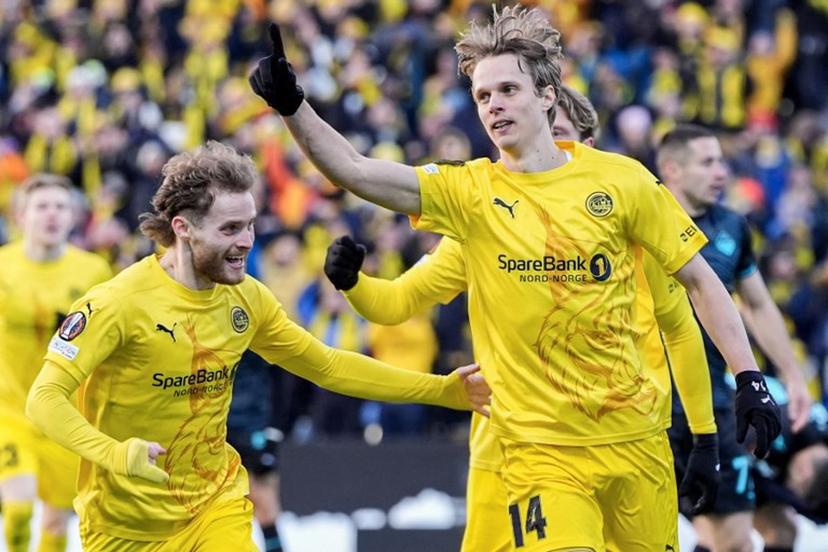 Bodoe/Glimt's Norwegian midfielder #14 Ulrik Saltnes (R) celebrates his 1-0 during the UEFA Europa League Quarter Final, 1st leg football match Bodo/Glimt v S S Lazio in Bodo, Norway, on April 10, 2025.  Lise Åserud / NTB / AFP