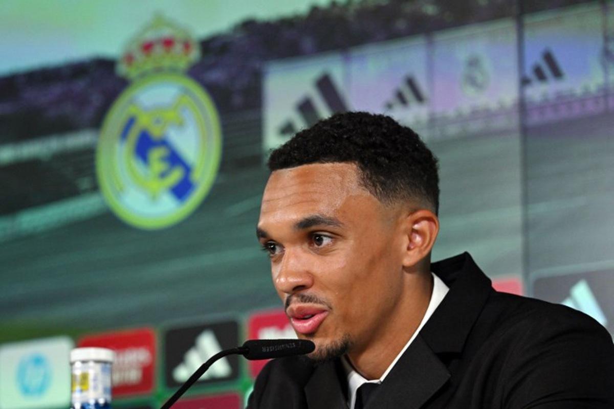 English defender Trent Alexander-Arnold gives a press conference during his official presentation as a new Real Madrid CF player, at the Ciudad Real Madrid training complex in Valdebebas, on the outskirts of Madrid, on June 12, 2025. Trent Alexander-Arnold said at his Real Madrid presentation today he feels a "big responsibility" to deliver for his new club. The right-back, who signed from Liverpool for a fee to speed up his arrival ahead of the Club World Cup, surprised as he gave a short speech in Spanish. "Signing for a club like Real Madrid does not happen every day. It's a dream come true," Alexander-Arnold told reporters. JAVIER SORIANO / AFP