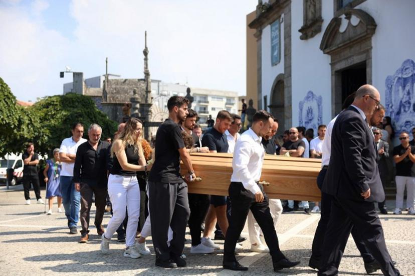 Relatives follow the coffin of Portuguese football player Diogo Jota carried out of the church after the funeral ceremony of Liverpool's Portuguese forward Diogo Jota and his brother Andre Silva at the Mother Church of Gondomar, on the outskirts of Porto, on July 5, 2025. Liverpool forward Diogo Jota and his brother died in a car crash in Spain on July 3, 2025, sparking widespread grief just after the Portugal star had got married. FILIPE AMORIM / AFP