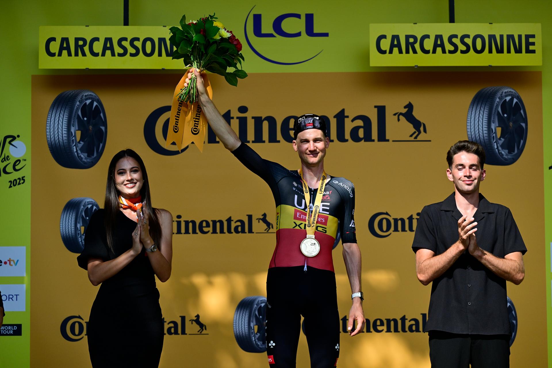 Belgian Tim Wellens of UAE Team Emirates and pictured on the podium after winning the stage 15 of the 2025 Tour de France cycling race, from Muret to Carcasonne (169 km), on Sunday 20 July 2025 in France. The 112th edition of the Tour de France starts on Saturday 5 July in Lille, France, and will finish in Paris, France on the 27th of July.   BELGA PHOTO DIRK WAEM