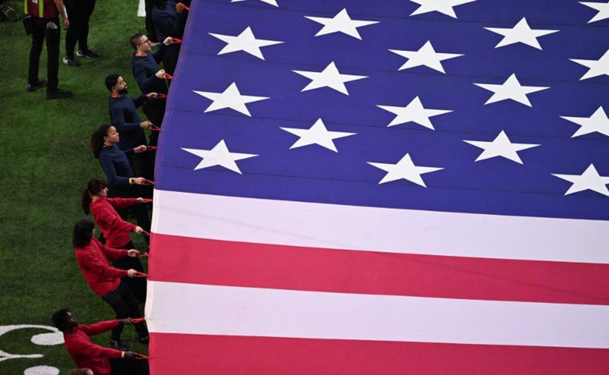 A giant US flag is displayed on the field ahead of Super Bowl LIX between the Kansas City Chiefs and the Philadelphia Eagles at Caesars Superdome in New Orleans, Louisiana, February 9, 2025.  Chandan Khanna / AFP