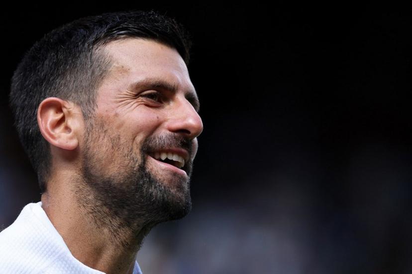 Serbia's Novak Djokovic speaks to the audience after winning his men's singles second round tennis match against Britain's Daniel Evans on the fourth day of the 2025 Wimbledon Championships at The All England Lawn Tennis and Croquet Club in Wimbledon, southwest London, on July 3, 2025.  Adrian Dennis / AFP
