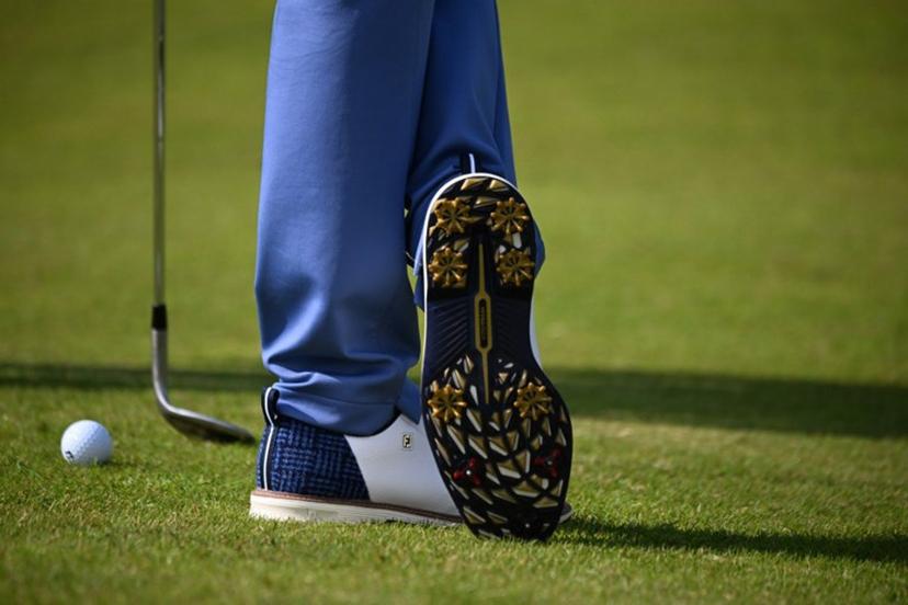 A detailed view of the shoes of US golfer Justin Thomas, seen during practice ahead of the 152nd British Open Golf Championship at Royal Troon on the south west coast of Scotland on July 15, 2024.  ANDY BUCHANAN / AFP