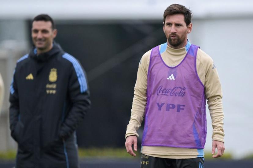 Argentina's forward Lionel Messi (R) gestures next to coach Lionel Scaloni during a training session in Ezeiza, Buenos Aires province, Argentina, on September 2, 2025, ahead of the FIFA World Cup 2026 qualifier football match against Venezuela on September 4 at the Monumental Stadium in Buenos Aires.   JUAN MABROMATA / AFP