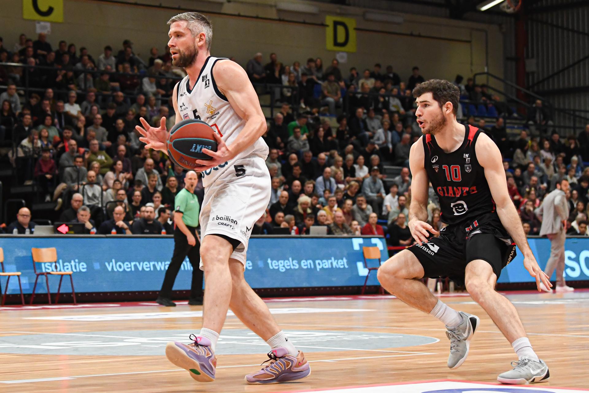 Limburg's Quentin Serron and Antwerp's Andrew Funk pictured in action during a basketball match between Limburg United and Antwerp Giants, Friday 19 December 2025 in Hasselt, on day 12 of the 'BNXT League' Belgian/ Dutch first division basket championship. BELGA PHOTO JILL DELSAUX