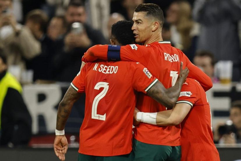 Portugal's forward #07 Cristiano Ronaldo (2nd R) celebrates scoring his team's second goal with his teammates during the UEFA Nations League semi-final football match between Germany and Portugal in Munich, southern Germany on June 4, 2025.  Alexandra BEIER / AFP