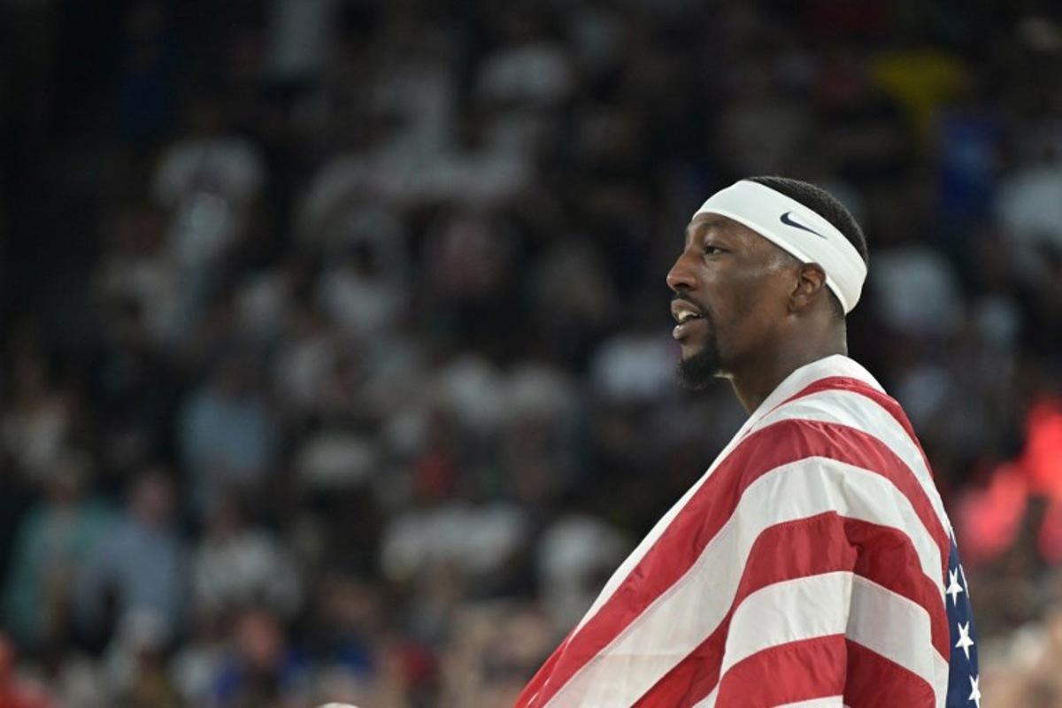 USA's #13 Bam Adebayo celebrates after the USA won the men's Gold Medal basketball match between France and USA during the Paris 2024 Olympic Games at the Bercy  Arena in Paris on August 10, 2024.  Damien MEYER / AFP