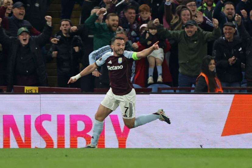 Aston Villa's Scottish midfielder  #07 John McGinn celebrates scoring the opening goal during the UEFA Europa League, round of 16 second-leg football match between Aston Villa and Lille LOSC at Villa Park in Birmingham, central England on March 19, 2026.  Darren Staples / AFP