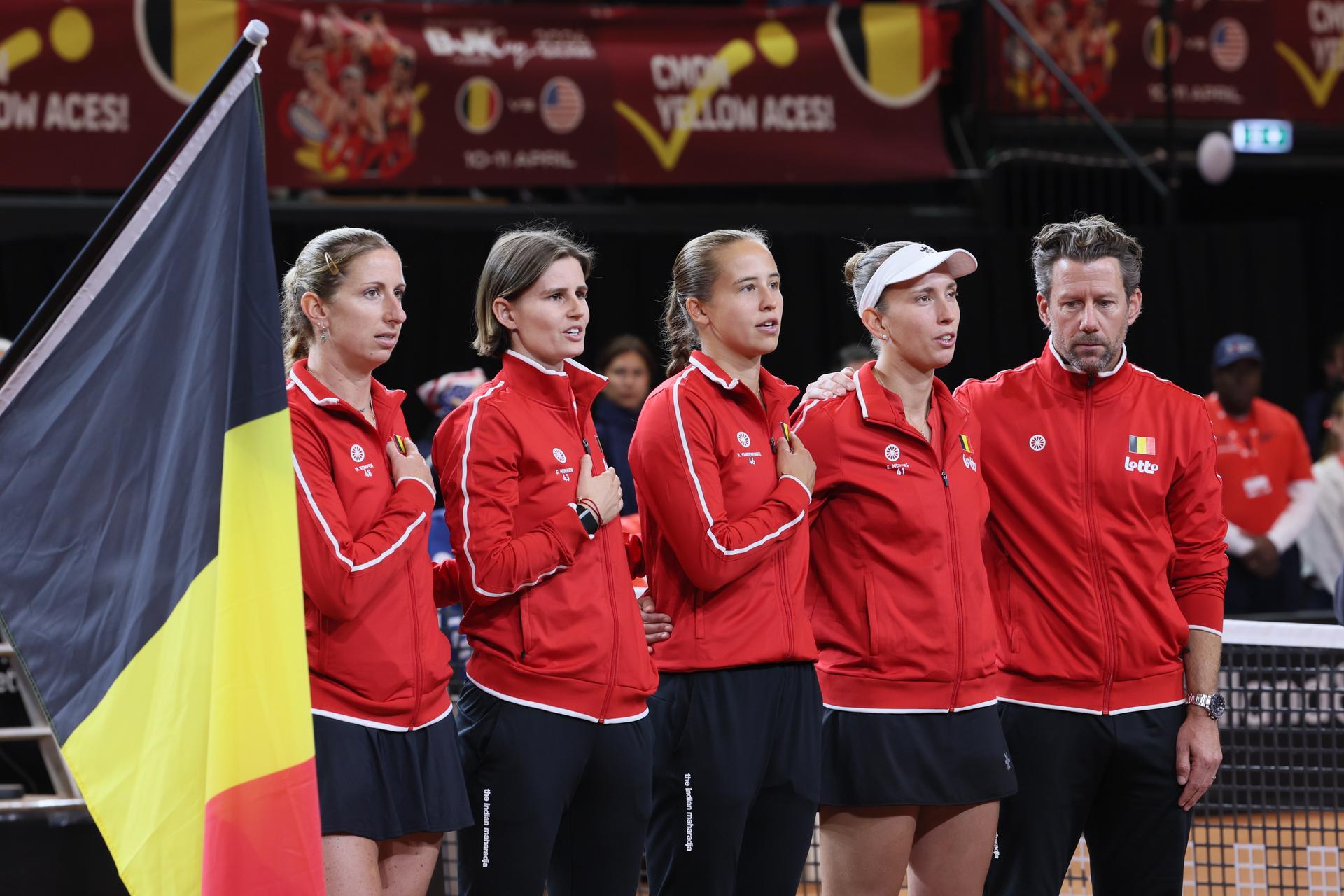 Belgium's team picture before the third game, a double game between Belgian pair Kempen/ Minnen and US pair McNally/ Melichar on the second day of the qualifiers of the Billie Jean King Cup tennis between Belgium and the USA, in Oostende, Belgium, on . The meeting takes place on 10 and 11th April. PHOTO BENOIT DOPPAGNE