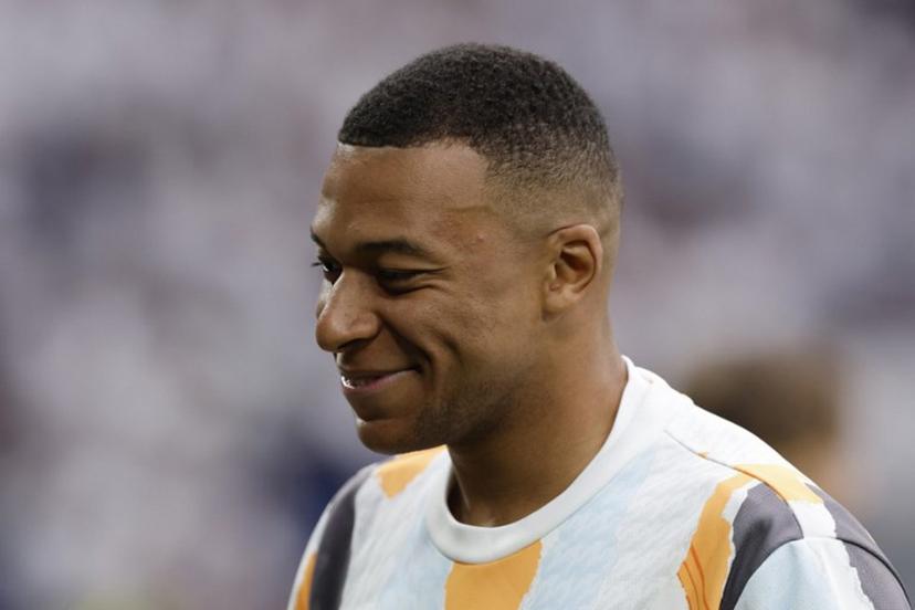 Real Madrid's French forward #09 Kylian Mbappe smiles prior to the Spanish league football match between Real Madrid CF and Real Sociedad at Santiago Bernabeu Stadium in Madrid on May 24, 2025.  OSCAR DEL POZO / AFP