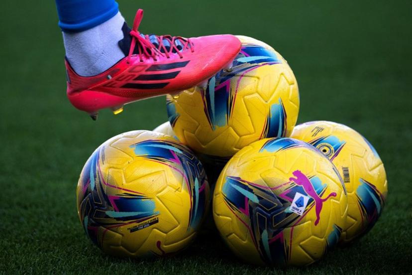 (FILES) The winter edition of the Series A official balls are pictured before the Italian Serie A football match Torino vs Napoli at the "Stadio Grande Torino" in Turin on December 1, 2024.  The last four matches of the 33rd day of the Italian football championship, scheduled on April 21, 2025, have been postponed on April 23, 2025 after the death of Pope Francis. MARCO BERTORELLO / AFP