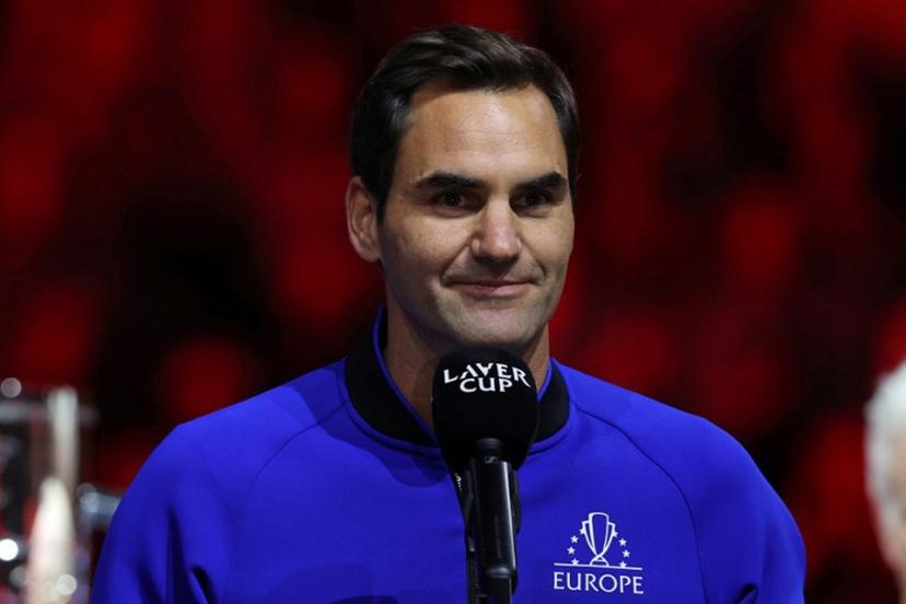 Switzerland's Roger Federer speaks at the presentation ceremony as Team World players celebrate victory over Team Europe in the 2022 Laver Cup at the O2 Arena in London on September 25, 2022. Team World win the tournament, beating Team Europe 13-8 Adrian DENNIS / AFP