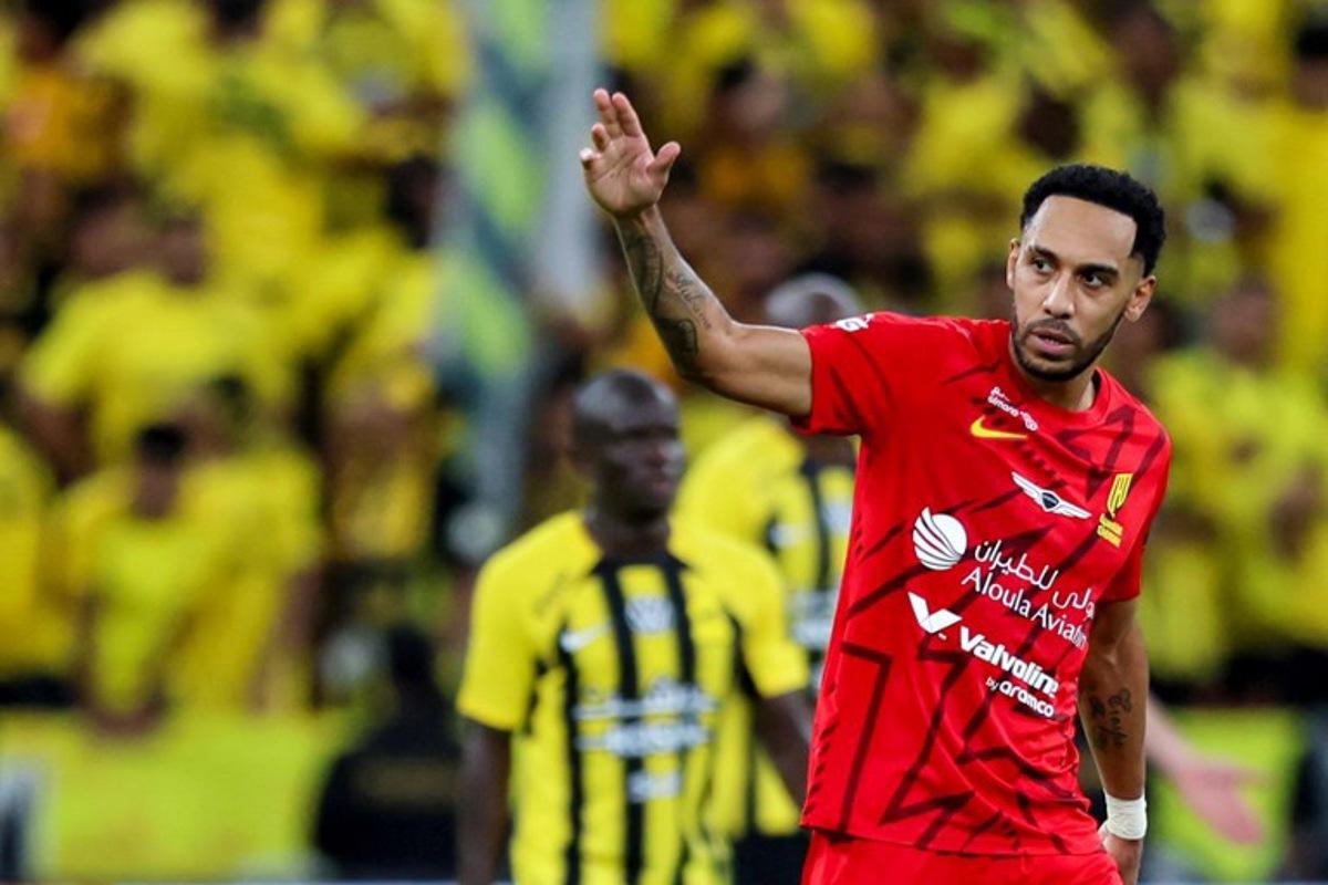 Qadsiah's Gabonese forward #10 Pierre-Emerick Aubameyang reacts after scoring during the King's Cup final match between Ittihad FC and Qadsiah FC at the King Abdullah Sport City Stadium in Jeddah on May 30, 2025.  Abdel Ghani BASHIR / AFP