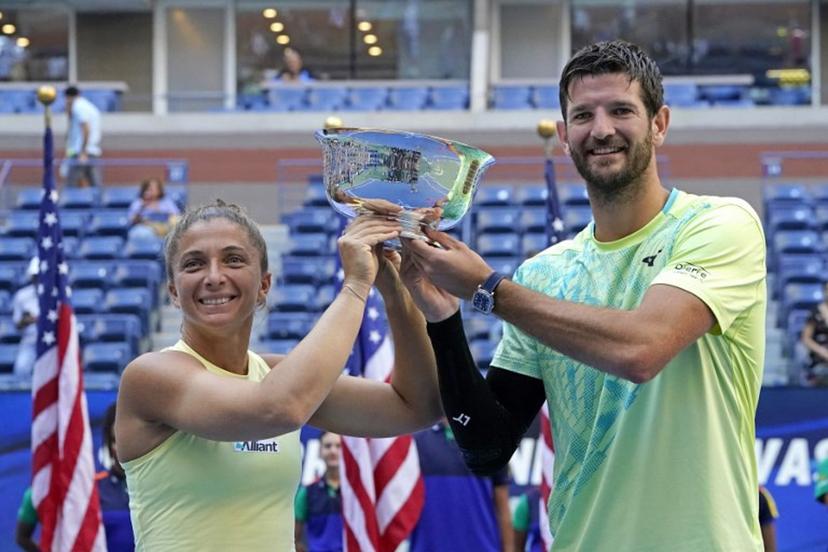 Italy's Sara Errani (L) and Andrea Vavassori celebrate with the trophy after defeating USA's Taylor Townsend and Donald Young play in their mixed doubles final match on day eleven of the US Open tennis tournament at the USTA Billie Jean King National Tennis Center in New York City, on September 5, 2024.  TIMOTHY A. CLARY / AFP