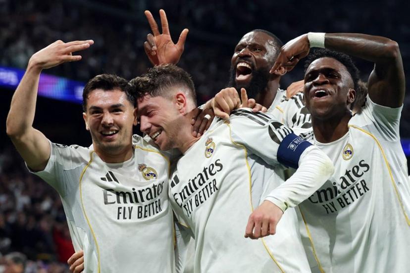 Real Madrid's Uruguayan midfielder #08 Federico Valverde (2L) celebrates his third goal during the UEFA Champions League last 16 first leg football match between Real Madrid CF and Manchester City at Santiago Bernabeu Stadium in Madrid on March 11, 2026.  Pierre-Philippe MARCOU / AFP