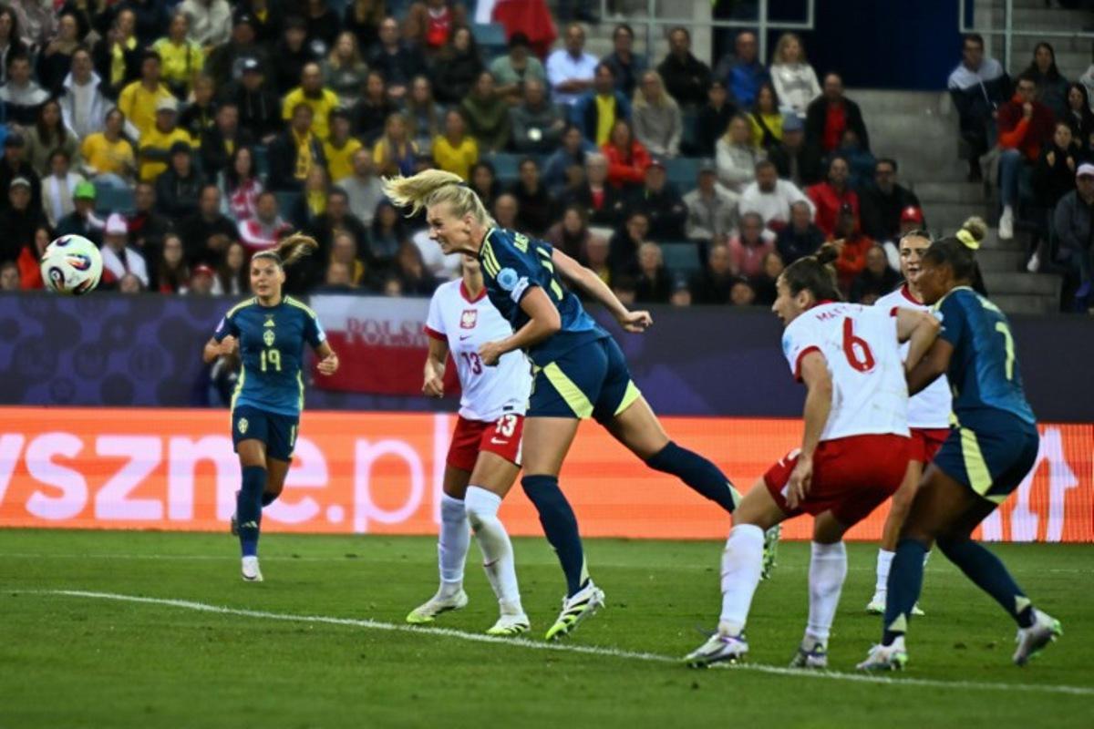 Sweden's forward #11 Stina Blackstenius (C) heads the ball to score Sweden's first goal during the UEFA Women's Euro 2025 Group C football match between Poland and Sweden at the Allmend Stadion Luzern in Lucerne on July 8, 2025.  Fabrice COFFRINI / AFP