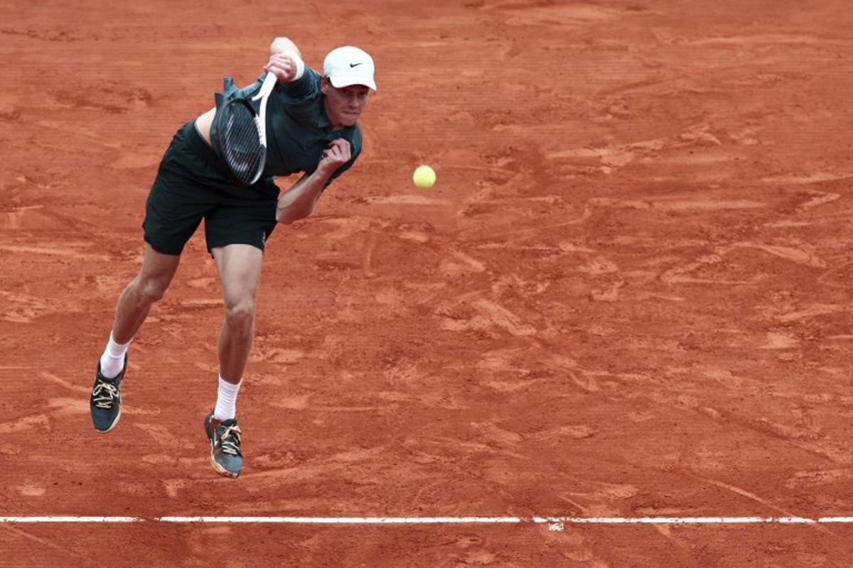 Italy's Jannik Sinner plays a backhand return to Germany's Alexander Zverev during the Monte Carlo ATP Masters Series Tournament semi-final tennis match on Court Rainier III at the Monte-Carlo Country Club in Roquebrune-Cap-Martin, south-eastern France on April 11, 2026.  Thibaud MORITZ / AFP