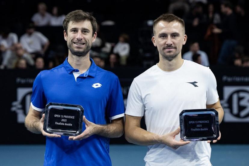 Second-placed Belgium's Sander Gille (L) and Poland's Jan Zielinski pose with their trophies after losing the men's doubles final tennis match against France's Benjamin Bonzi and France's Pierre-Hughes Herbert during the Marseille Open 13 ATP World Tour in Marseille, southern France on February 16, 2025.  MIGUEL MEDINA / AFP