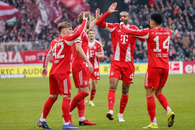 Bayern Munich's English forward #09 Harry Kane (2nd L) celebrates scoring the 0-2 goal with his teammates during the German first division Bundesliga football match between SV Werder Bremen and FC Bayern Munich in Bremen, northern Germany February 14, 2026.   Focke Strangmann / AFP