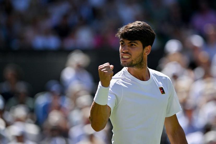 Spain's Carlos Alcaraz celebrates winning the first set against US player Taylor Fritz during their men's singles semi-final tennis match on the twelfth day of the 2025 Wimbledon Championships at The All England Lawn Tennis and Croquet Club in Wimbledon, southwest London, on July 11, 2025.  Glyn KIRK / AFP