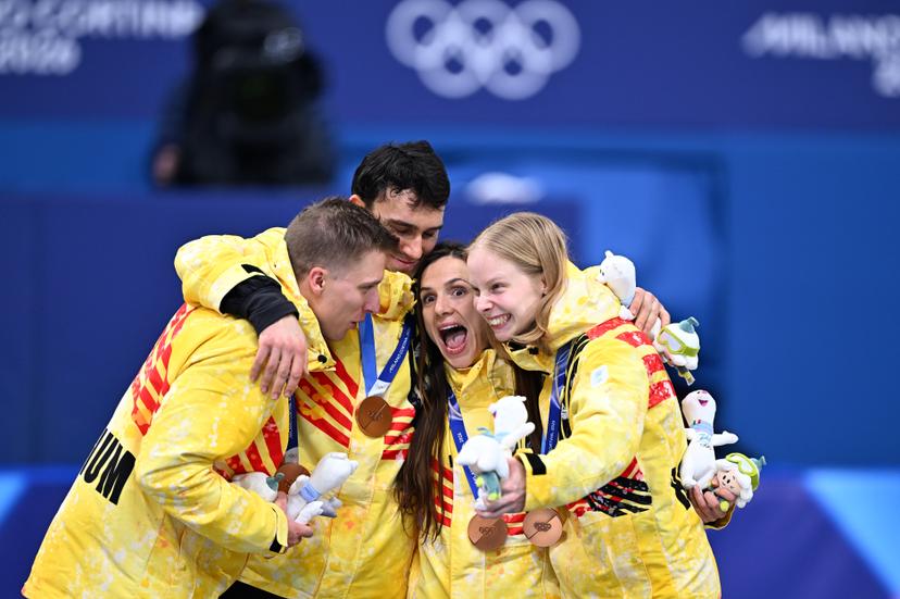 Belgian shorttrack skater Ward Petre, Belgian shorttrack skater Stijn Desmet, Belgian shorttrack skater Hanne Desmet and Belgian shorttrack skater Tineke den Dulk celebrate their bronze medal on the podium of the Mixed Team Relay of the Short Track Speed Skating competition at the Milano Cortina 2026 Olympic Winter Games, on Tuesday 10 February 2026 in Milan, Italy. The XXV Winter Olympics take place from 6 to 22 February 2026 in Italy. BELGA PHOTO JASPER JACOBS