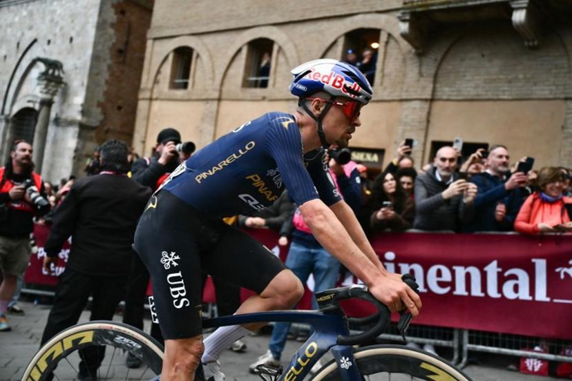 Pinarello-Q36.5 Pro Cycling Team PQT's British Thomas Pidcock rides after crossing the finish line of the 20th one-day classic 'Strade Bianche' (White Roads) men's cycling race between Siena and Siena in Tuscany on March 7, 2026.  Marco BERTORELLO / AFP