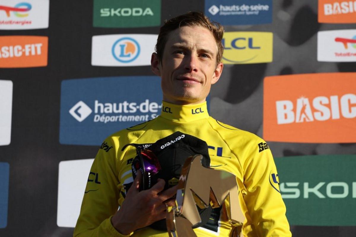 Team Visma - Lease a Bike's Danish rider Jonas Vingegaard celebrates with the trophy after winning the 2026 Paris-Nice cycling race, on March 15, 2026.  Anne-Christine POUJOULAT / AFP